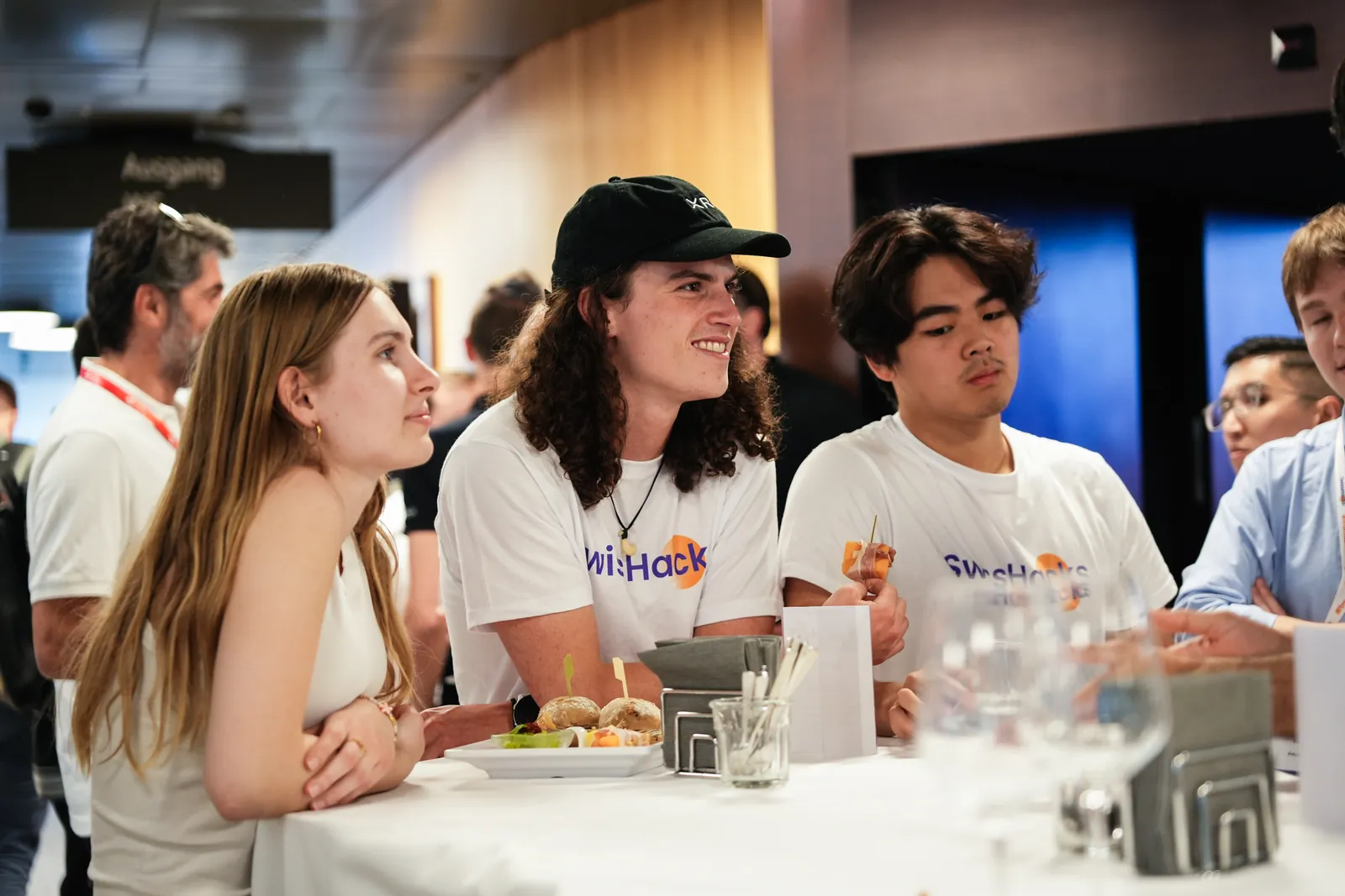 Felix Du and teammates in SwissHacks shirts between builds